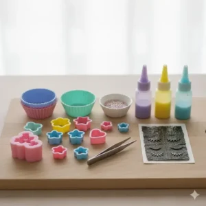 Image of the necessary bento tools, including small cookie cutters, silicone cups, and tweezers, for creating the unicorn bento theme.