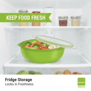 Organizing leftovers in the refrigerator using a tupperware green bowl with lid.